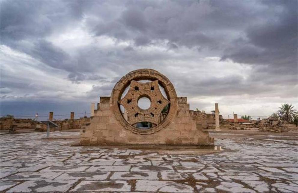 An intricately carved stone rosette on the Hisham’s Palace site