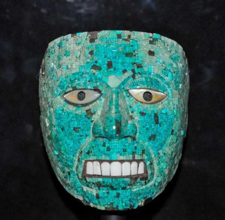 Turquoise mosaic Aztec mask of Xiuhtecuhtli, God of Fire. At the annual festival dedicated to Xiuhtecuhtli, slaves and captives were dressed as the deity and sacrificed in his honor.
