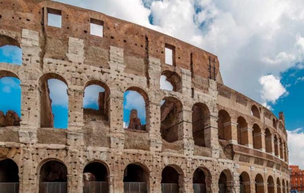 The outer walls of the Roman Colosseum, pockmarked by vandals who removed iron clamps