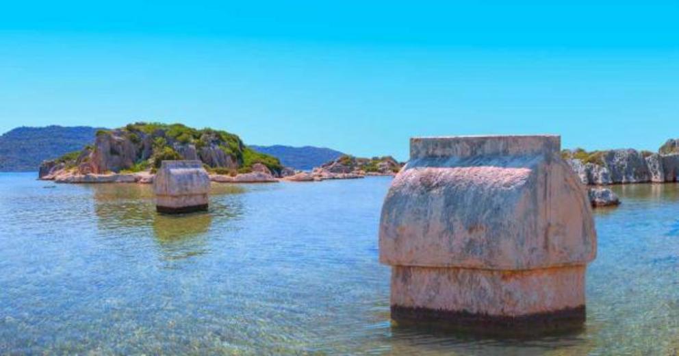 Ancient Lycian sarcophagus in water, Simena village, Kekova, Turkey.