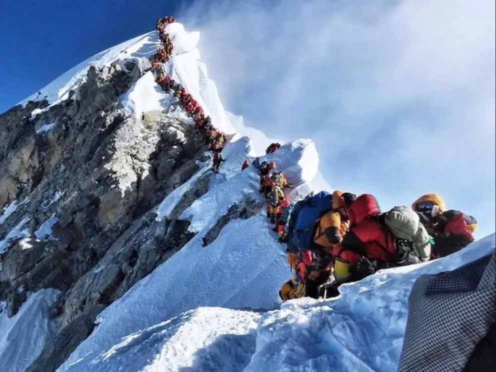 There is a deadly traffic jam on Mount Everest as climbers are forced to wait in the 