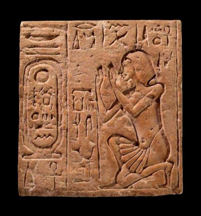 Limestone relief depicting the Overseer of Works, believed to be Nakhtpaaten, worshipping Akhenaten as the 