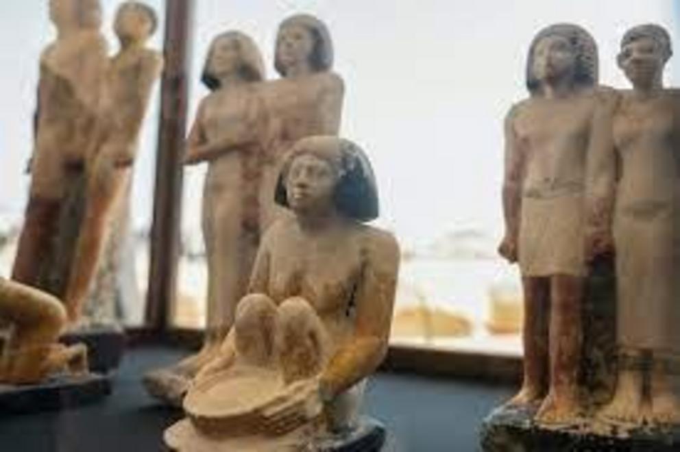 Statues displayed after the announcement of the discoveries in Saqqara, including couples holding hands.