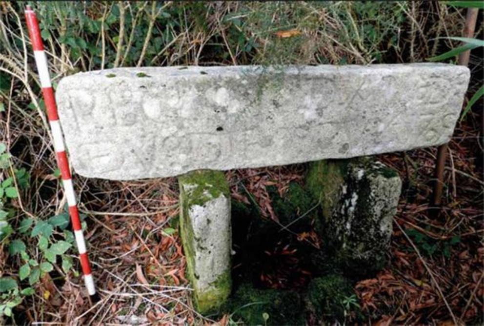 A carved stone with an inscription that describes an old chapel that once stood at the site of the medieval fortress at Castro Valente.