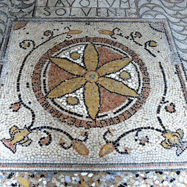  6th century Italian mosaic with the six petal rosette as a flower, among other botanical motifs.