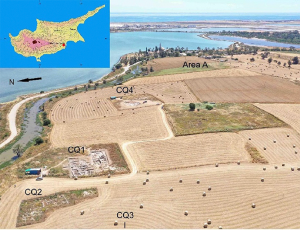 Drone image of Hala Sultan Tekke on the island of Crete with its excavated city quarters in the foreground, the harbor to the left and the Mediterranean Sea in the background.