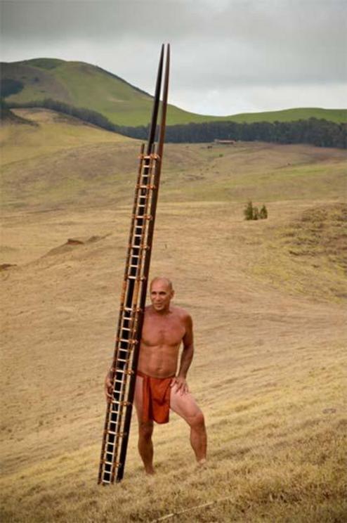 Tom Pohaku Stone in traditional clothing with his papa holua sled.