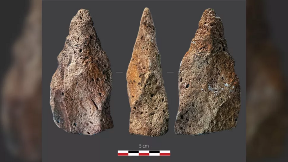 The archaeologists in southern Oman have also unearthed this stone hand-ax which may date from the first migrations of early humans out of Africa between 300,000 and 1.3 million years ago.