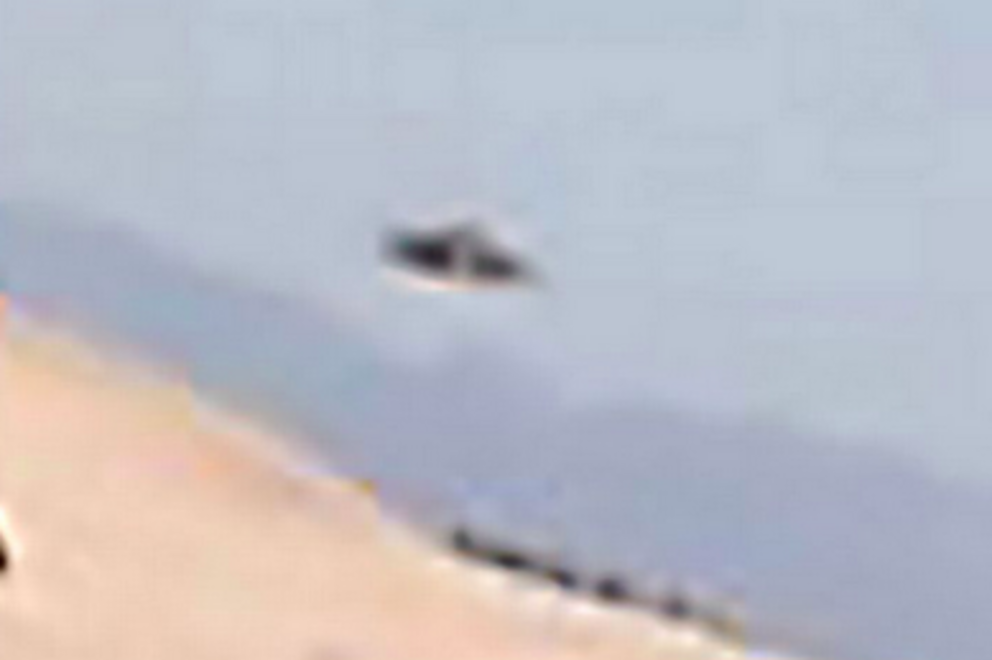 Ramiro Navarro's selfie with the UFO pictured in the background (Image: Jam Press/Ramiro Navarro)