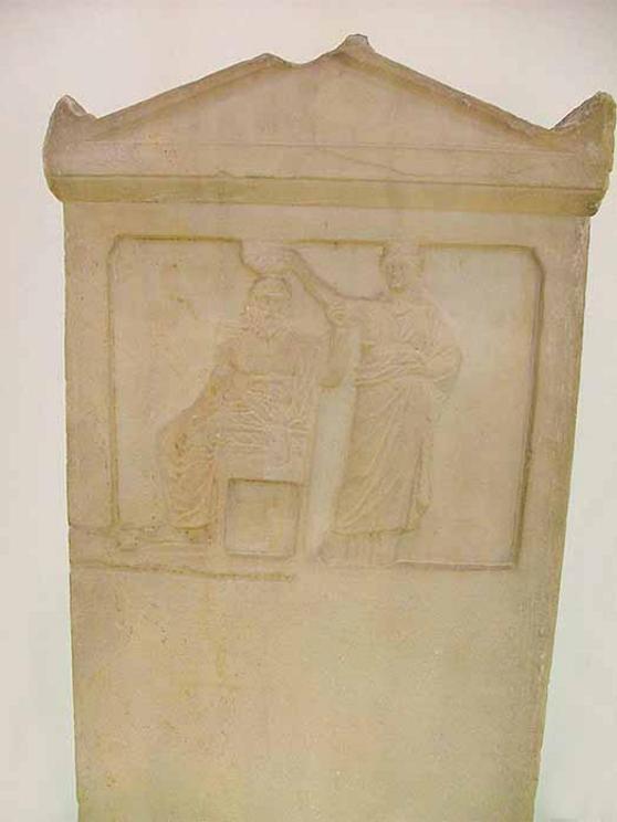 The relief representation depicts the personified Demos being crowned by Democracy (276 BC)