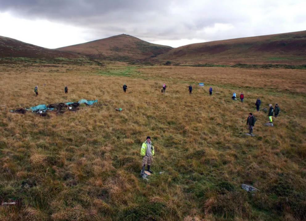 The team stands around one of the stone circles. Alan Endacott via Facebook