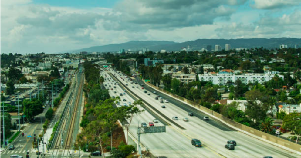 Aerial shot of the Santa Monica Freeway (Interstate 10) and the tracks of the Expo Line in Los Angeles.