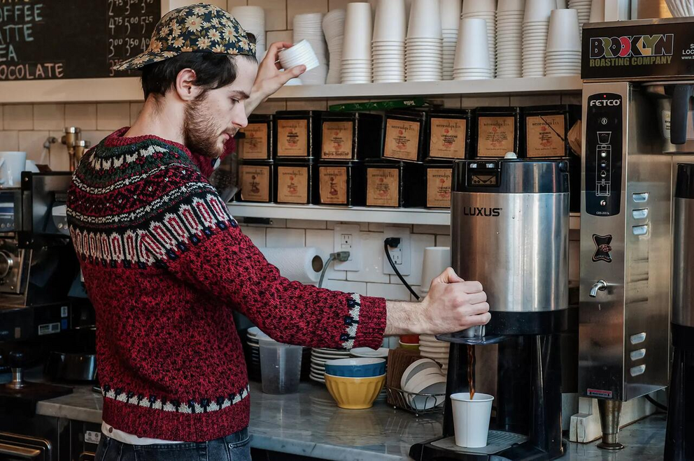 A barista pours a cup of coffee at Colson Patisserie in New York City on Feb. 22, 2016. The United States consumes 1.62 billion pounds of coffee per year, according to Cafely.