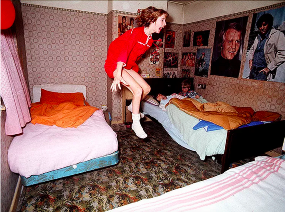 Janet Hodgson, pictured at age 11, appearing to be possessed in her bedroom. Photo: Graham Morris