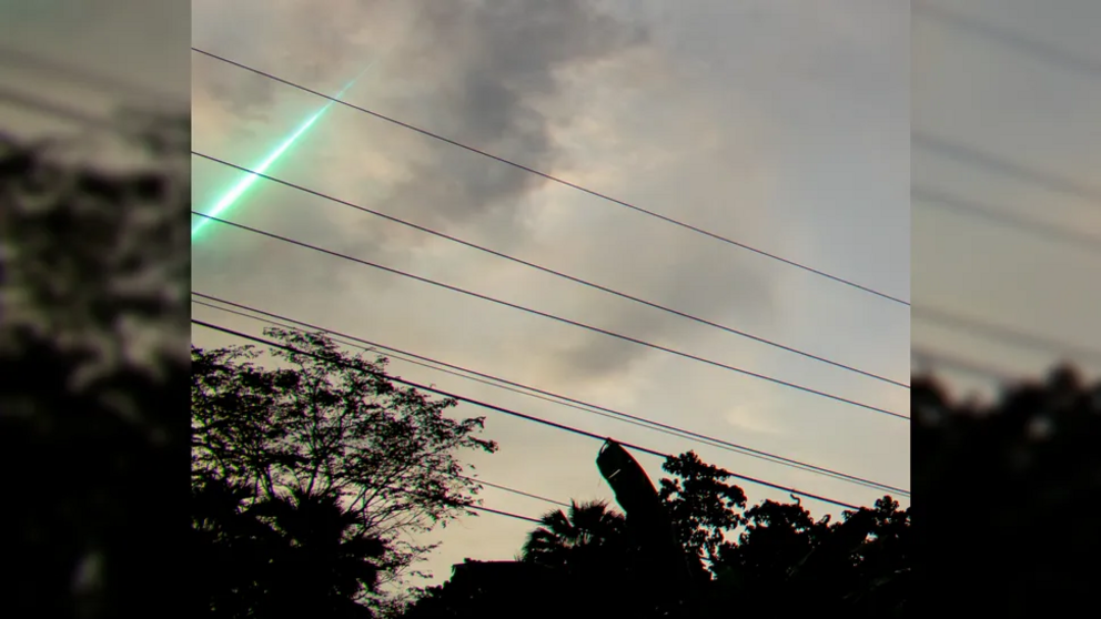 The meteor gave off bright green light as it began to burn up.