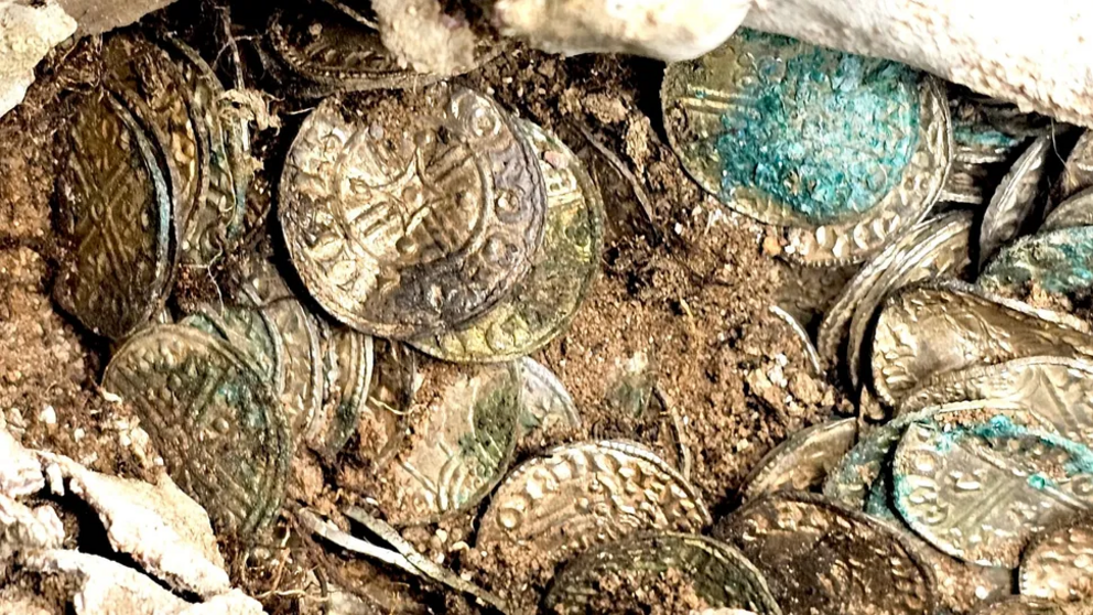 A close-up of silver coins excavated at the Sizewell C construction site.