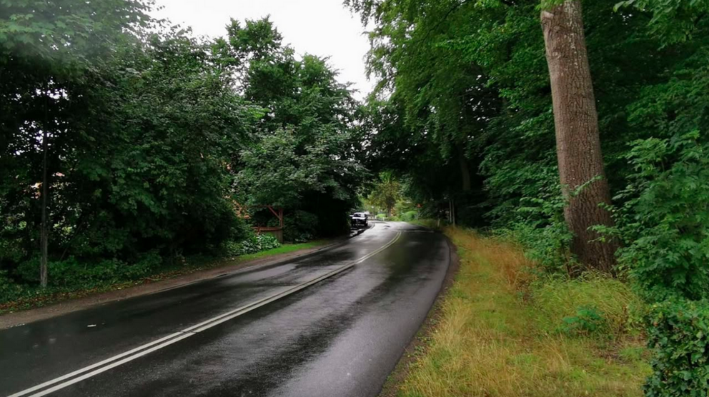 The place near the small wooded area where the craft had landed.