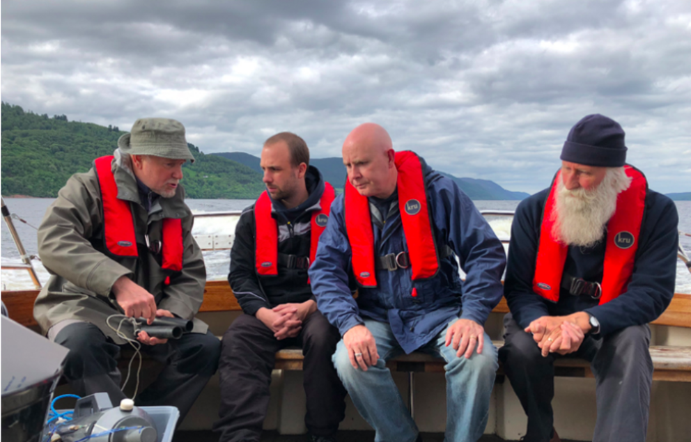 Eric Verspoor, Gert-Jan Jeunen, Neil Gemmell, and Adrian Shine aboard the boat Deepscan on Loch Ness. | Photo by Neil Gemmell