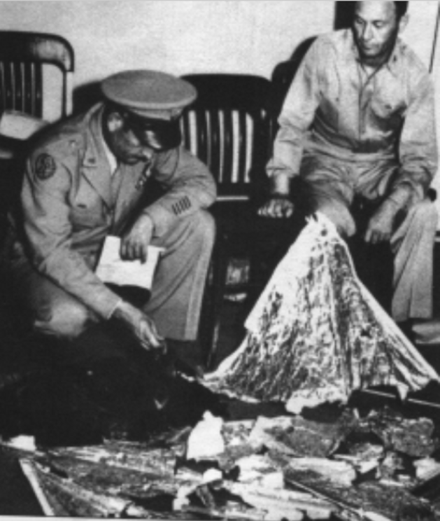 Roger Ramey and Thomas DuBose with the remains of a rawin target. Since there were no rawin targets on the early flights of Mogul balloons, the question is where did the rawin originate?